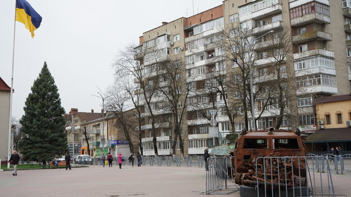 an old car is parked in front of a building